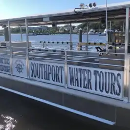 a boat of Southport Water Tours parked on the port