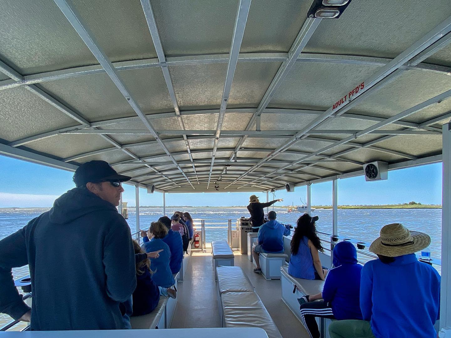 a group of people riding a boat of Southport Water Tours