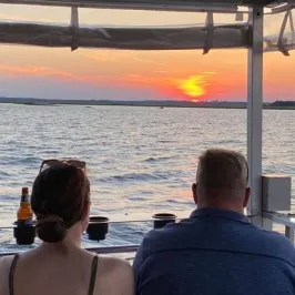 two people riding a boat of Southport Water Tours
