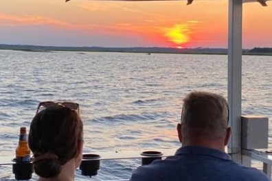 two people riding a boat of Southport Water Tours