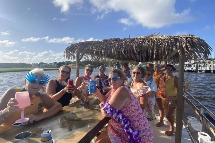 a group of people on a Tiki Boat